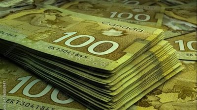 الدولار الكندي ينخفض إلى أدنى مستوياته في أكثر من 4 سنوات